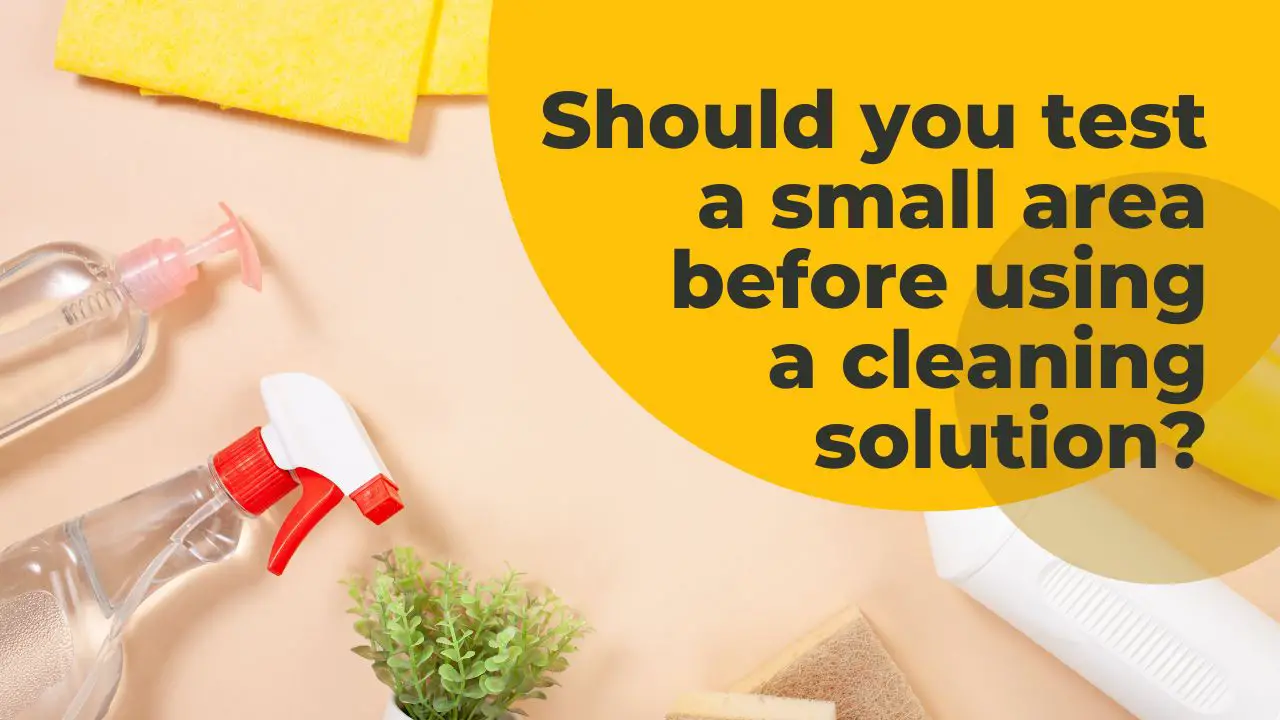 Why should you test a small area before applying any cleaning solution?